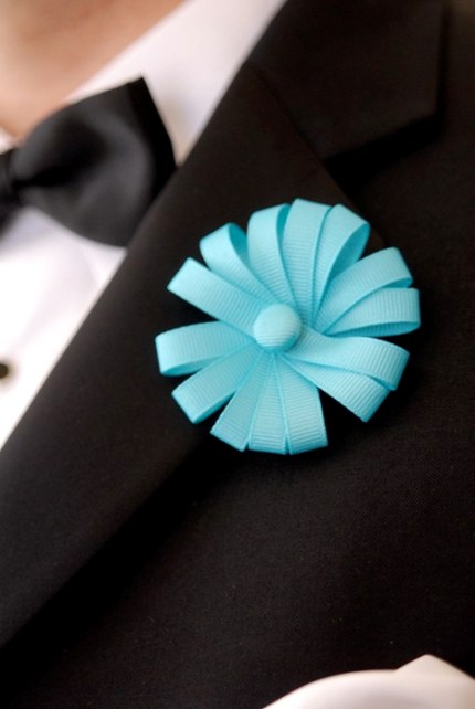 Groom's boutonierre made from teal ribbon