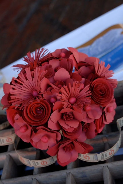Red bouquet made of paper flowers