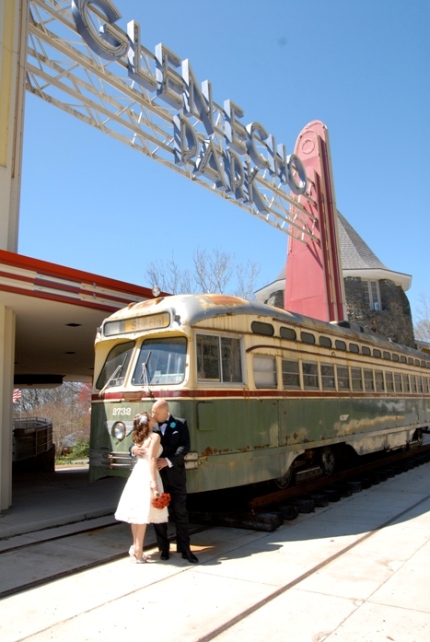 a decade of weddings - 2009 - Bride and Groom in front of the old green trolley at Glen Echo Park