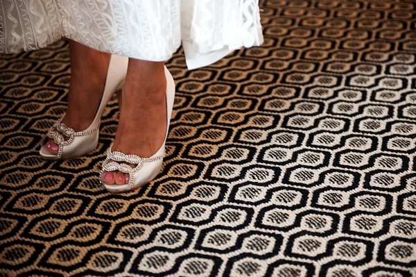 bride puts on her white shoes