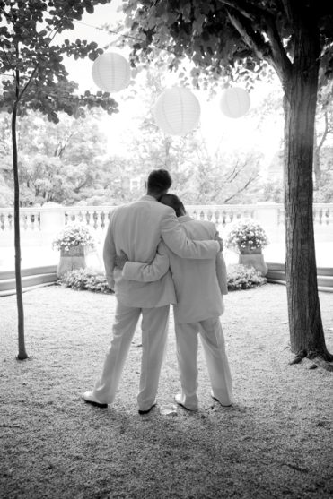 grooms hug before the ceremony