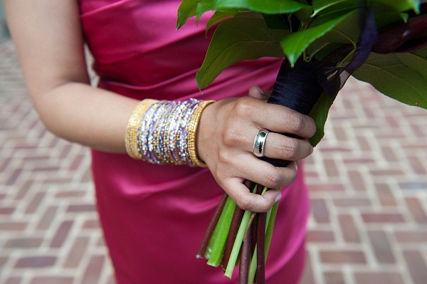 the maid of honor wears a lot of bangle bracelets