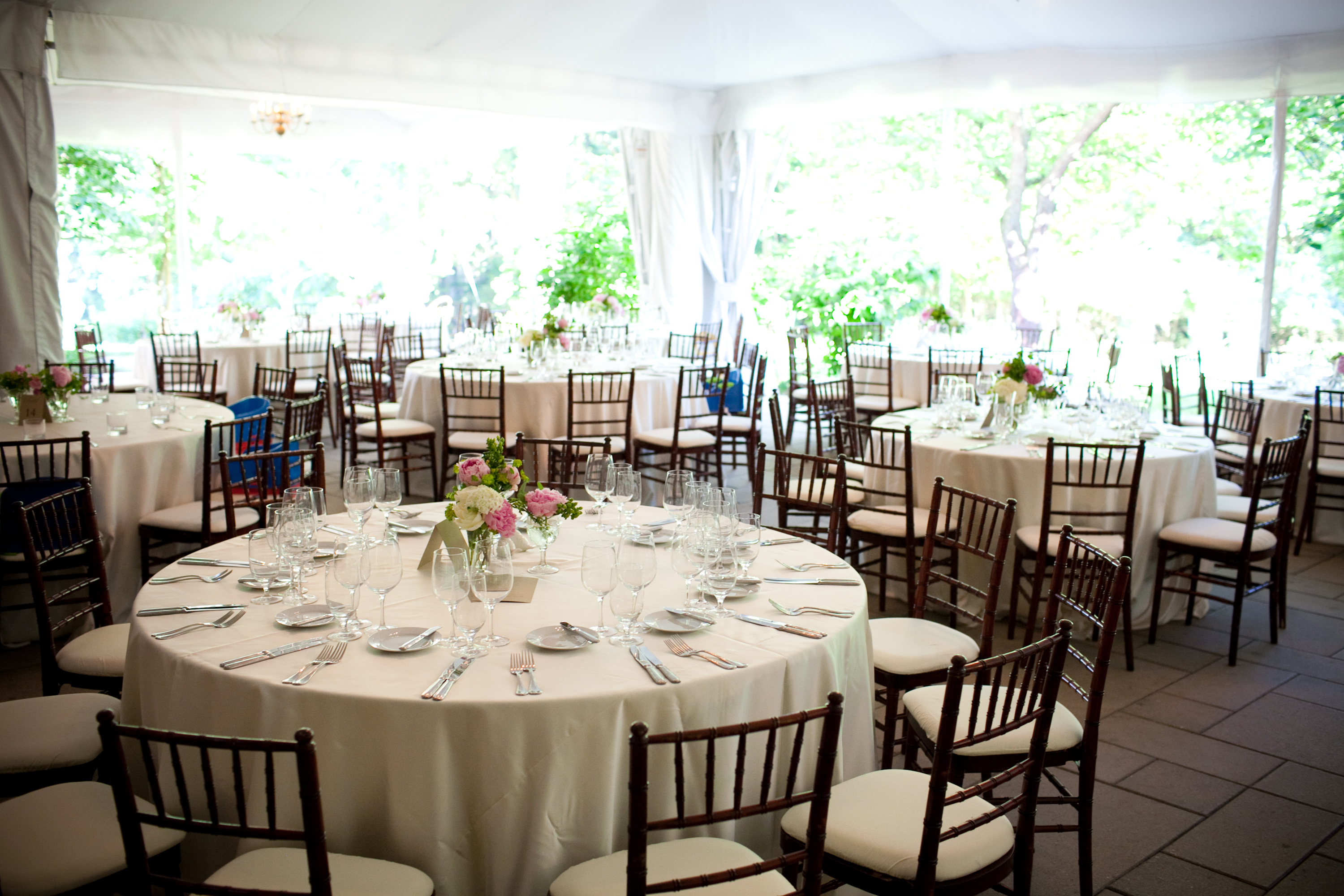 wide shot of the tent at Woodend - white linens, mahogany chivari chairs