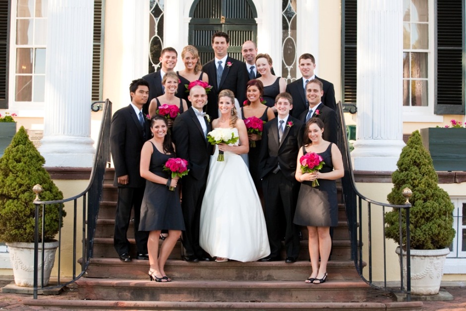 wedding party on the steps of the mansion