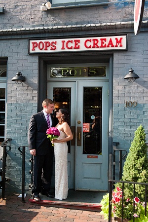 the bride and groom in front of Pop's Ice Cream in Alexandria