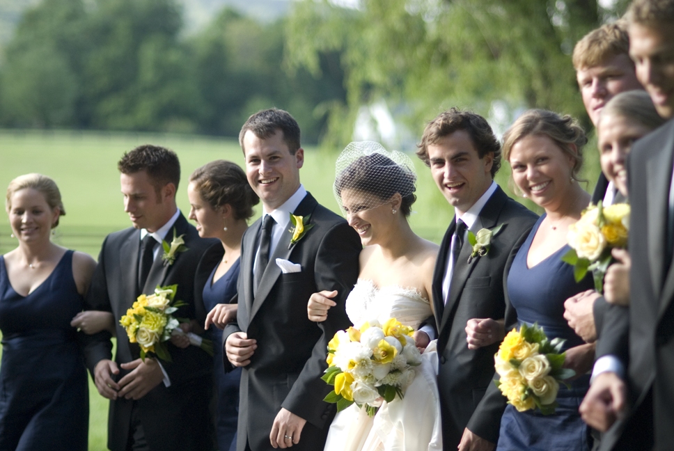 wedding party portrait - walk down the road arm in arm