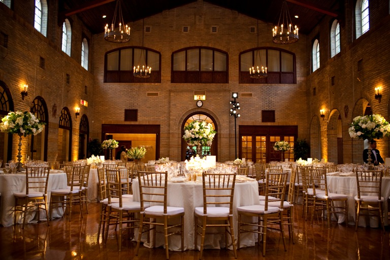 St Francis Hall before the guests arrive - cream linens, gold chairs and beautiful green and white flowers