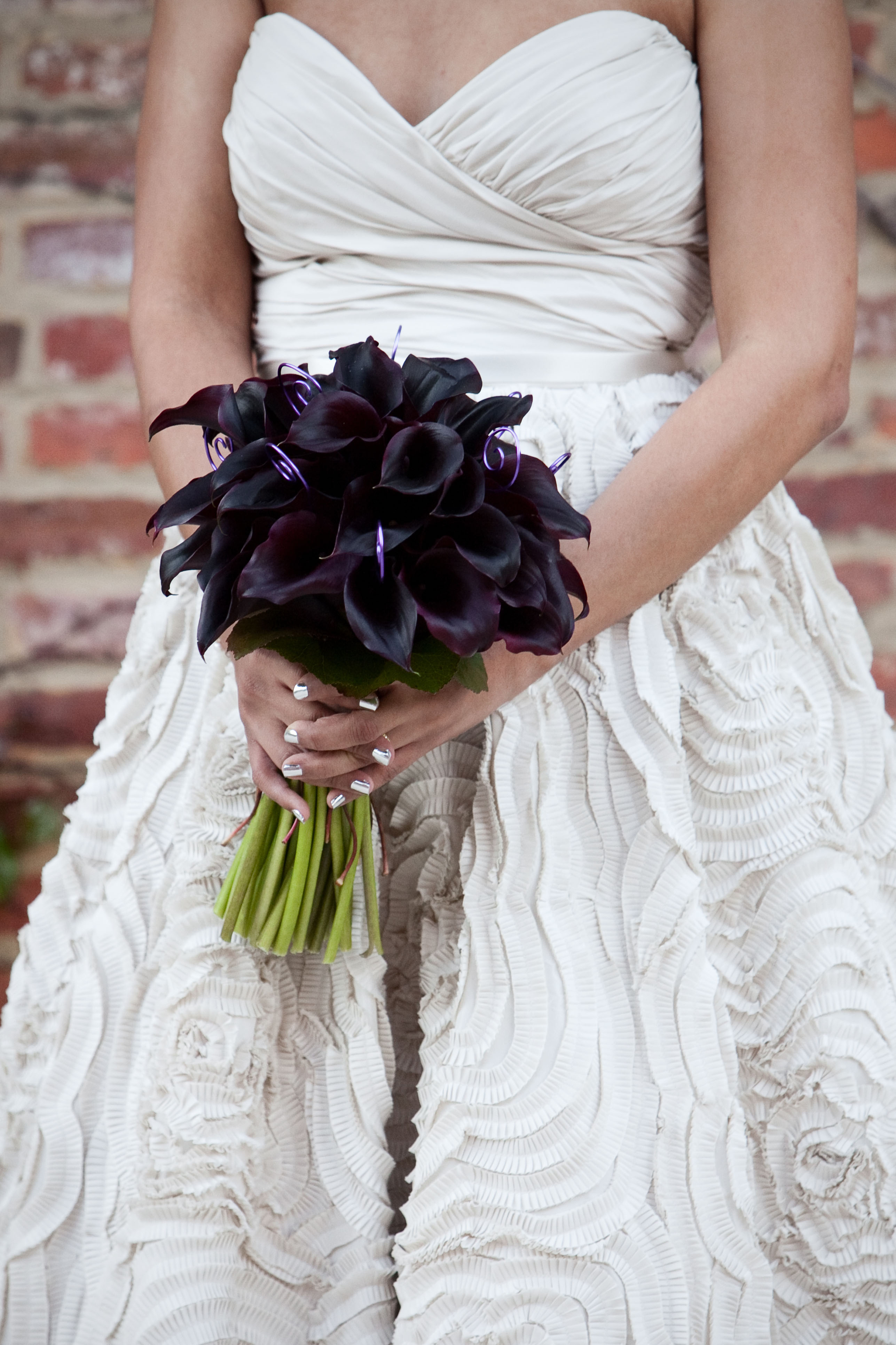 bridal bouquet of eggplant calla lillies and monkey's tail