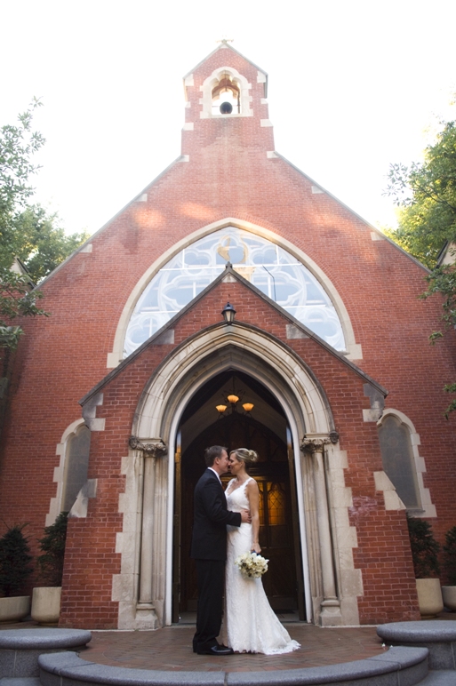 bride and groom kiss in the doorway of the chapel immediately after the ceremony