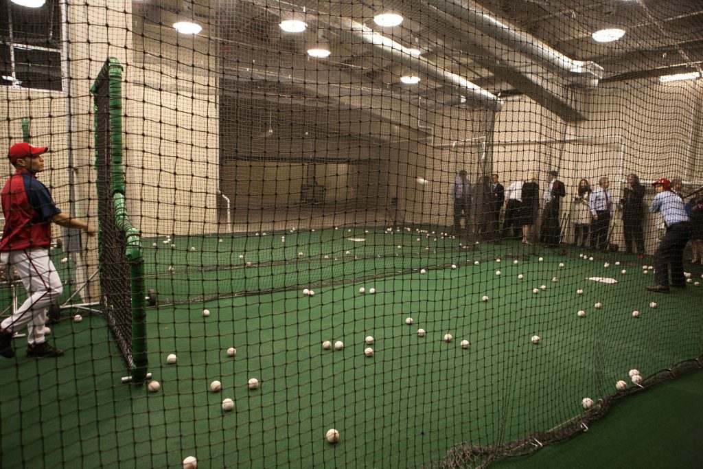 Nationals Park wedding - the guests take batting practice at the cocktail reception