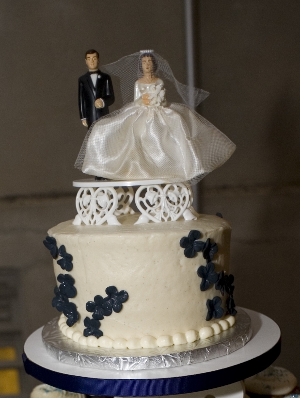 small round cake with vintage family heirloom cake topper