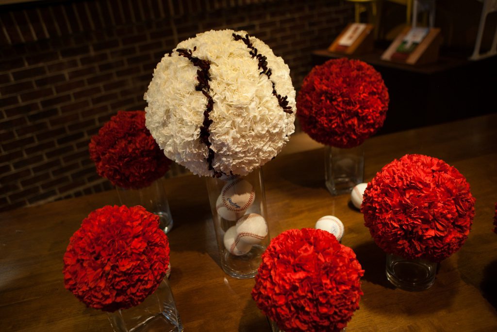 Nationals Park wedding - red carnation pomanders with a larger pomander designed to look like a baseball