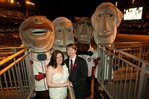 Bride and groom pose with the Racing Presidents