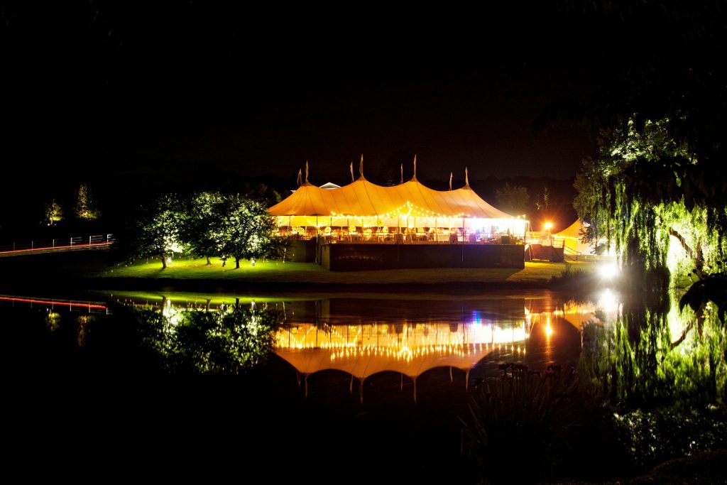 a decade of weddings - 2011 - The Sperry tent glows at night - private home wedding in Virginia