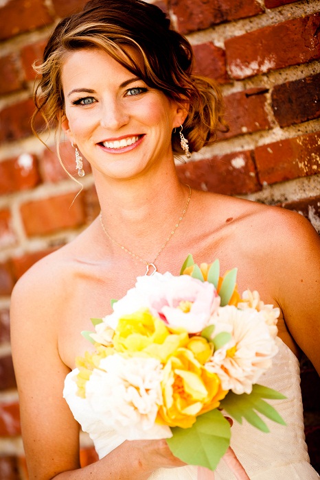 a bride with a paper flower bouquet