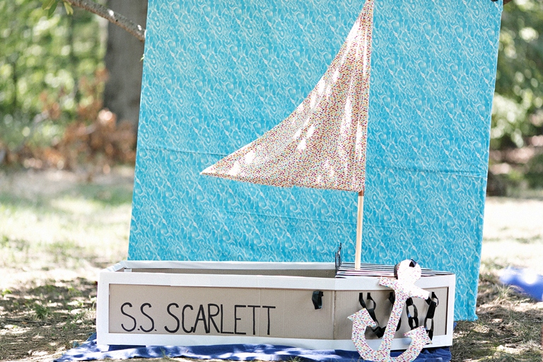 12  Tim Riddick Photography Lemonade Design Studio Bellwether Events Row Row Row Your Boat Nautical pastel rainbow first birthday party cardboard boat photo booth