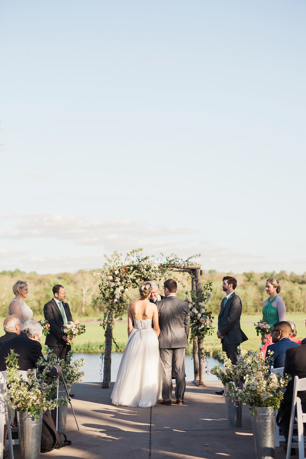 Riverside on the Potomac Leesburg Virginia outdoor wedding ceremony - Carly Romeo Photography - Bellwether Events - floral arch by LynnVale Studio