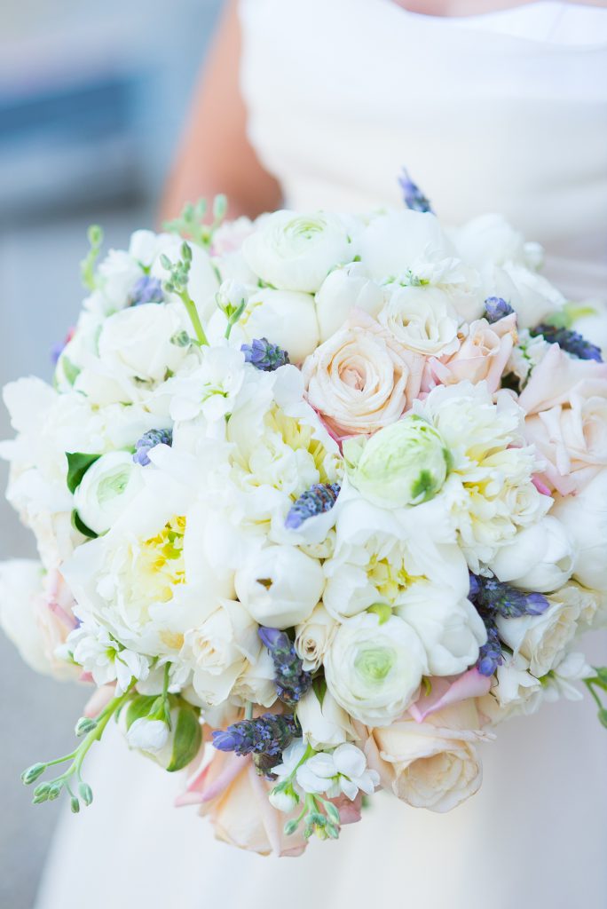A white bridal bouquet with pastel accents