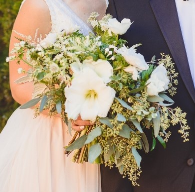 A green and white winter bridal bouquet with amaryllis. 