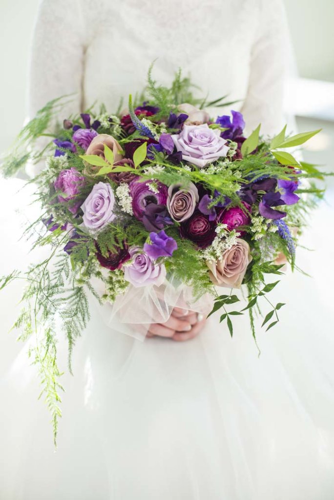 A bridal bouquet featuring shades of purple