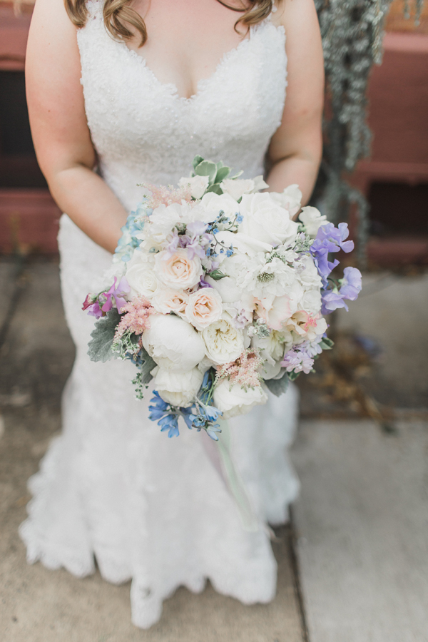 a white bridal bouquet with pastel accents 