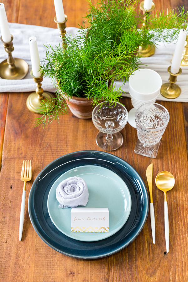 Blue, gold and white wedding table setting