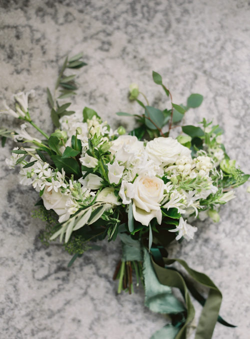 A green and white bridal bouquet