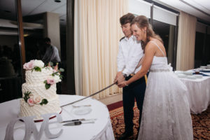 Wedding cake cutting with a military saber