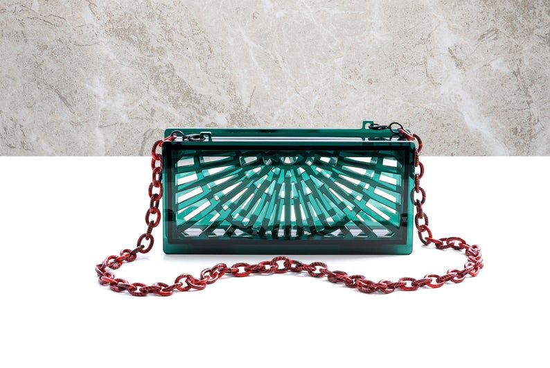 gift idea for women over $100: acrylic and translucent green clutch with strap