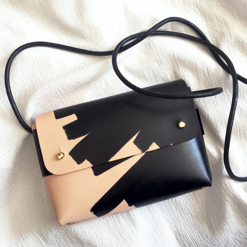 gift idea for women over $100: handmade black and tan cross body purse