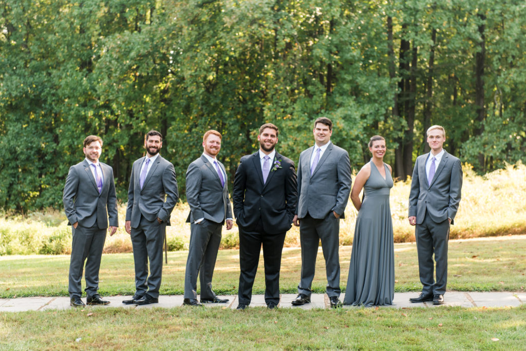 Woodend Sanctuary wedding - groom's party with men and women - gray suits and gray dress