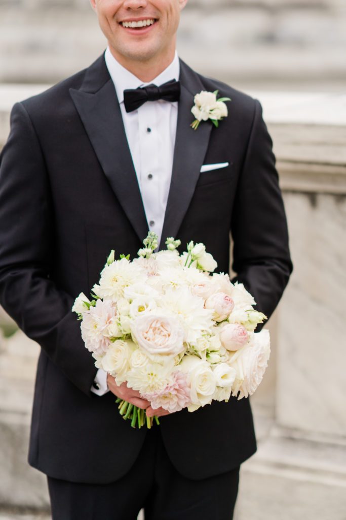 A white bouquet with blush accents