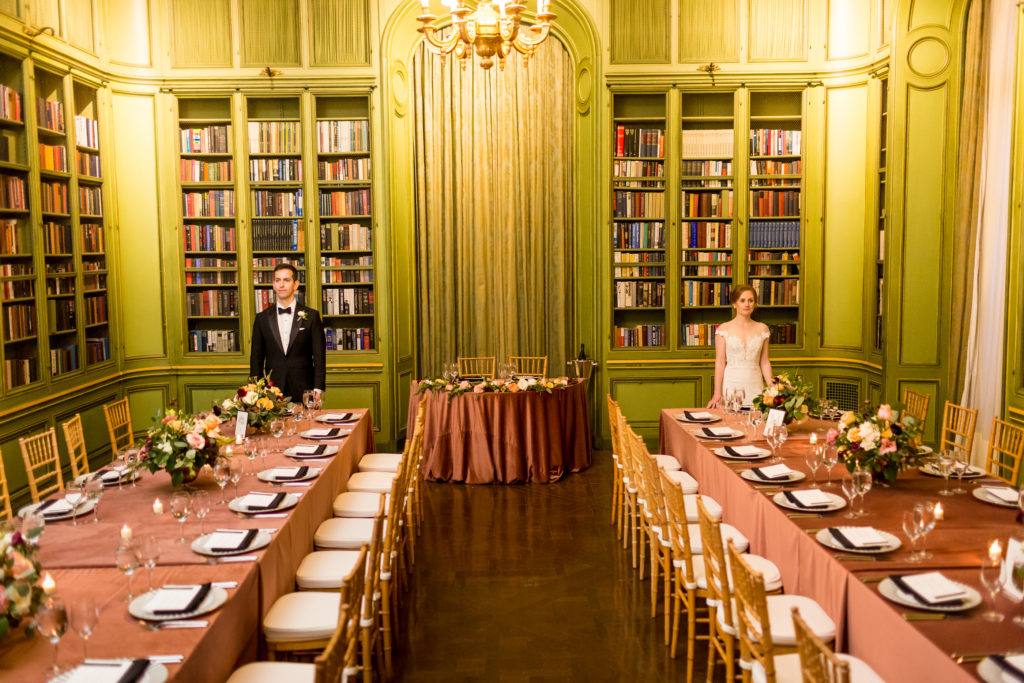 Meridian House DC wedding reception two long tables with dusty rose velvet linens and gold chairs set up in the Library. planned by Bellwether Events. 