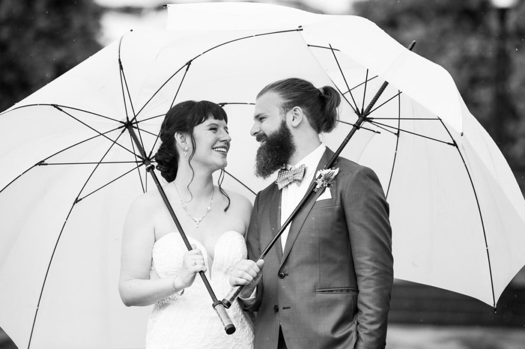DC micro wedding - couple under umbrellas