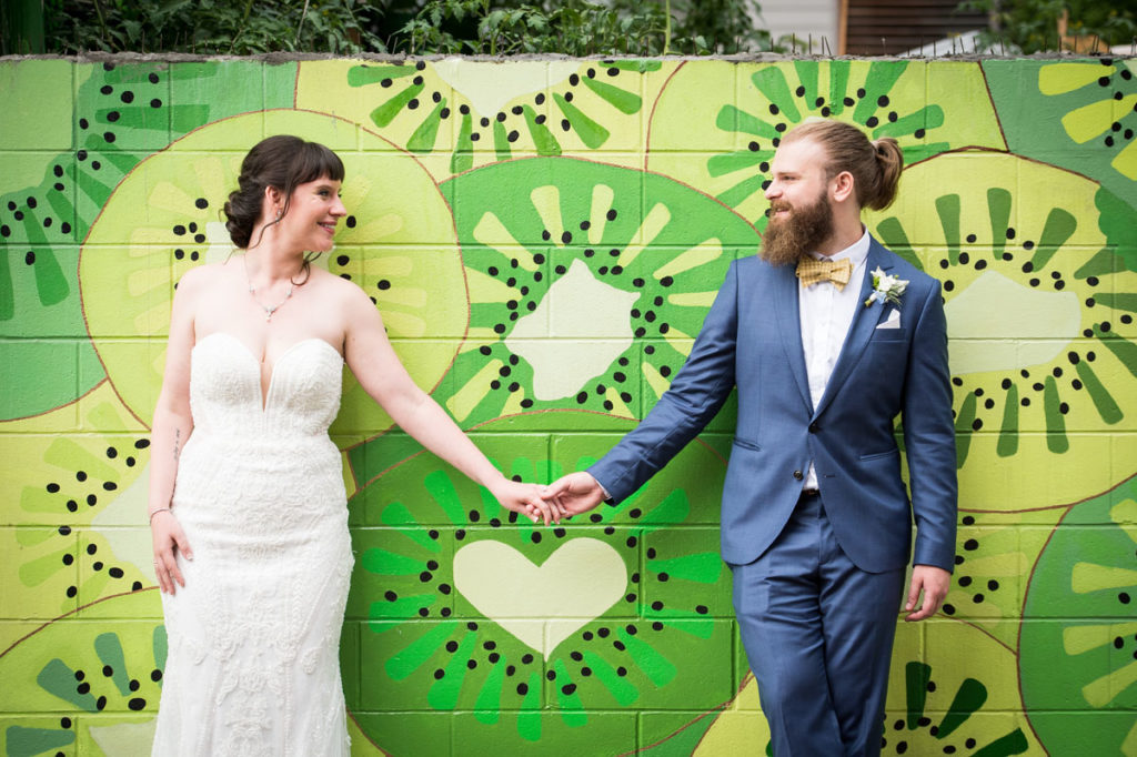 DC micro wedding - couple in front of a colorful wall mural