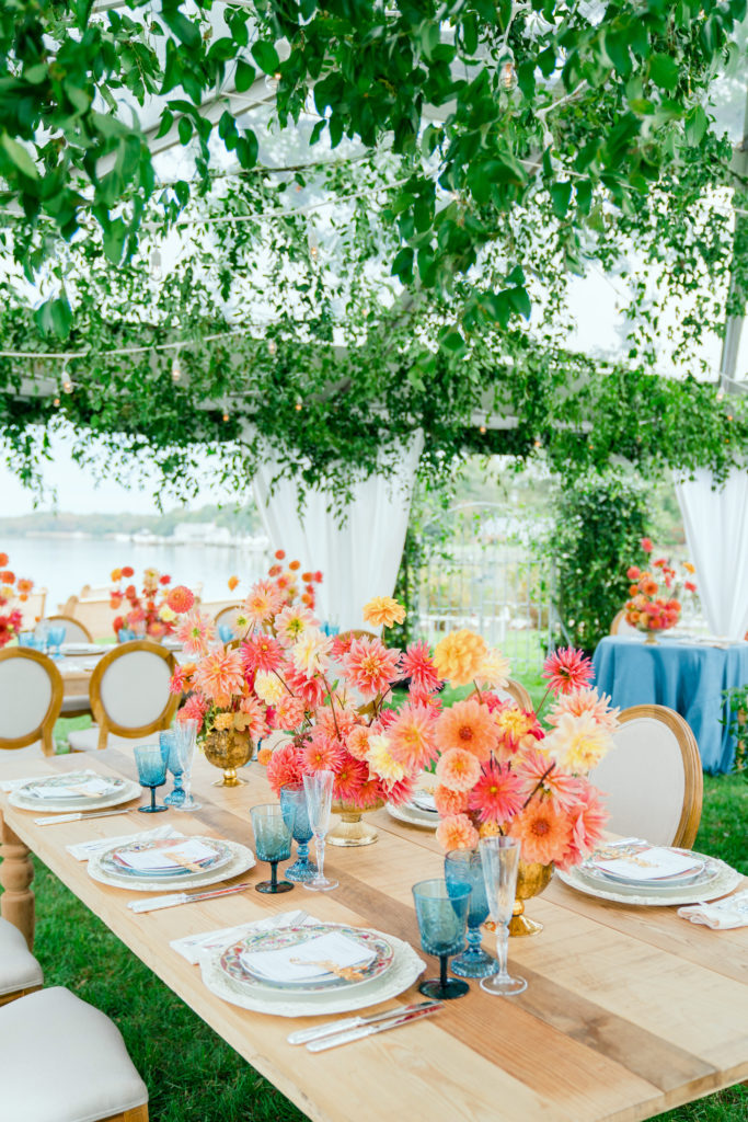 colorful coral centerpieces on farm tables - Waterfront Wedding Southern Maryland Bellwether Events Kurstin Roe Photography Sugarplum Tent Co