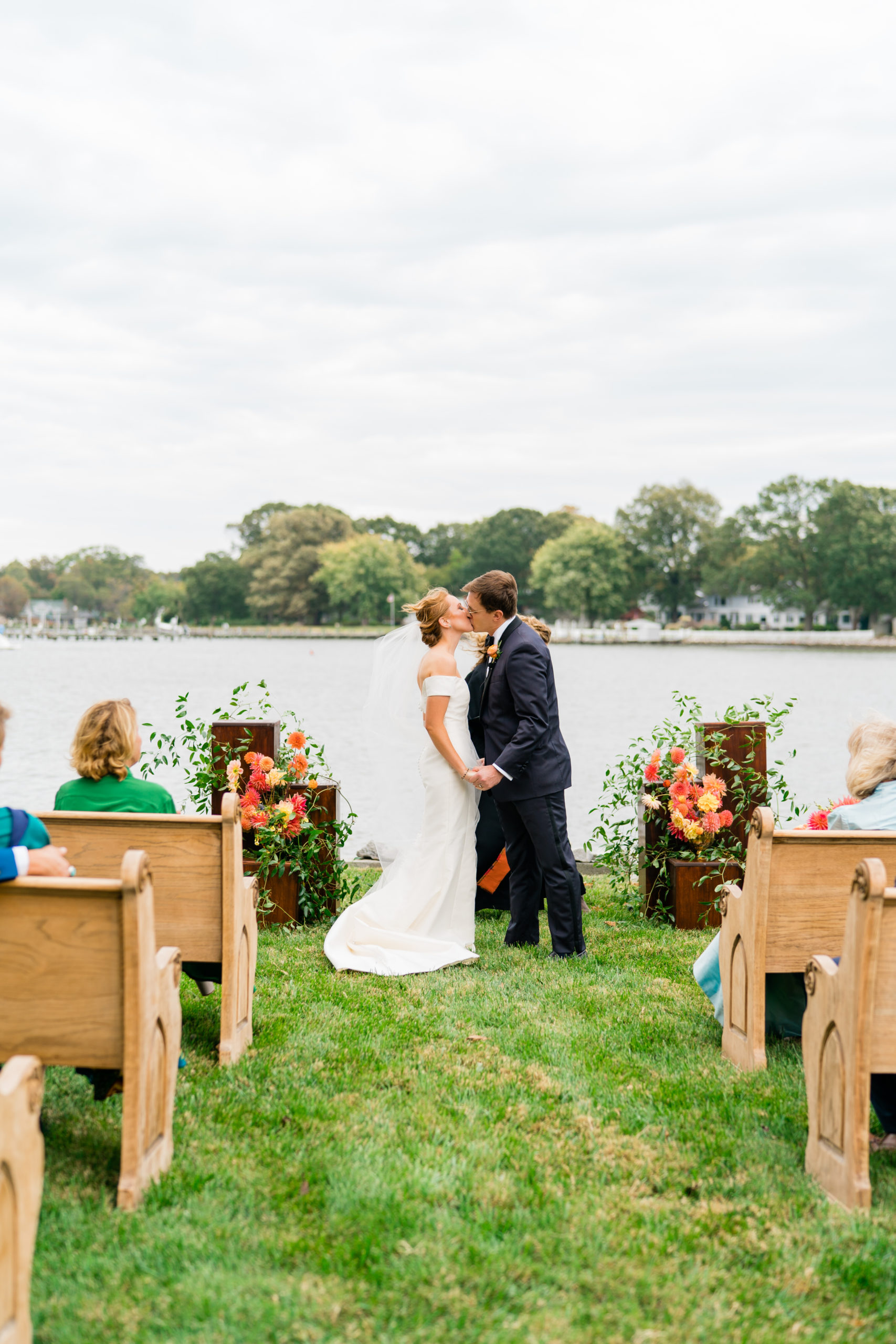 wedding ceremony first kiss - Waterfront Wedding Southern Maryland Bellwether Events Kurstin Roe Photography Sugarplum Tent Co