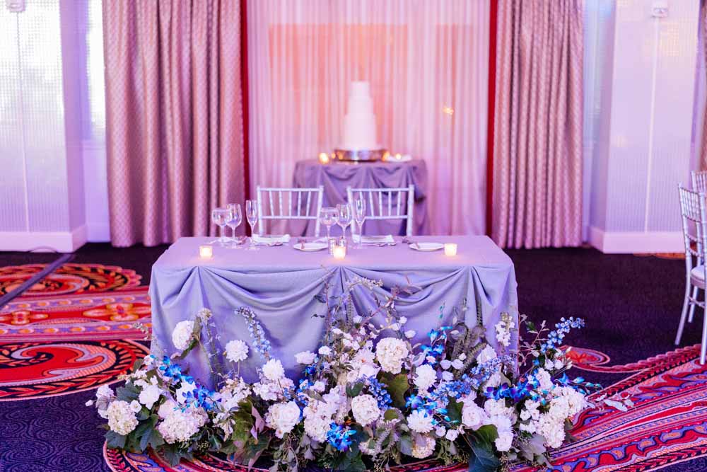 Hotel Monaco DC wedding reception sweetheart table blue purple synth wave