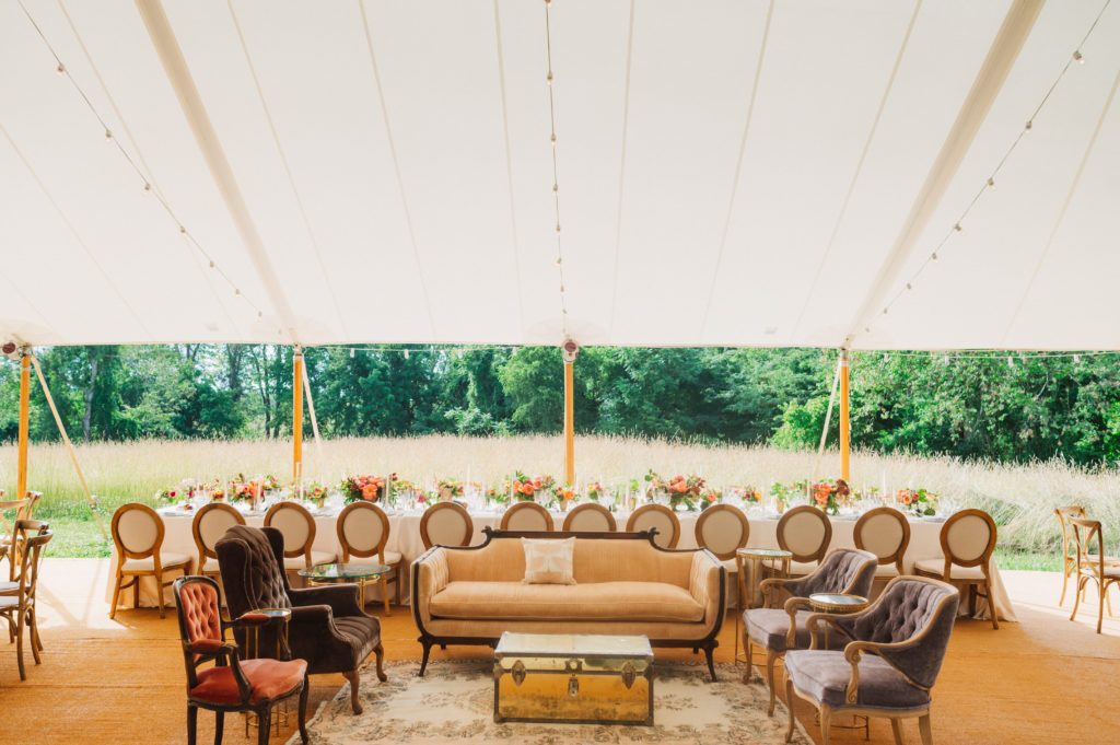 summer tented wedding lounge area and head table