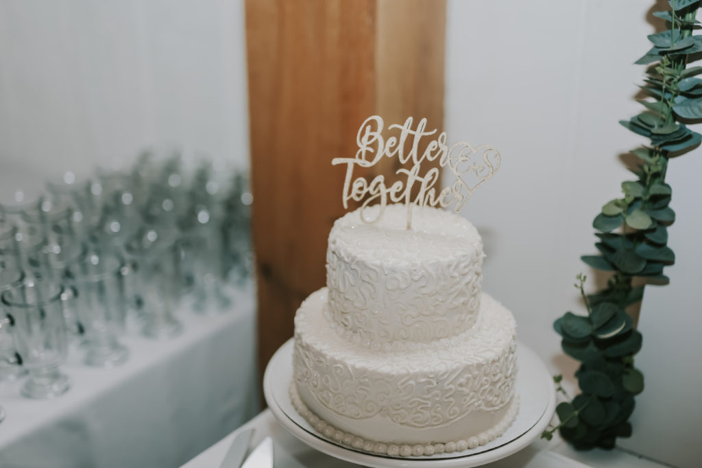 simple white buttercream wedding cutting cake
