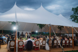 head table in a sperry tent at a family farm wedding