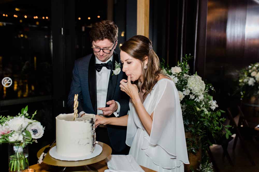 District Winery DC wedding reception cake cutting