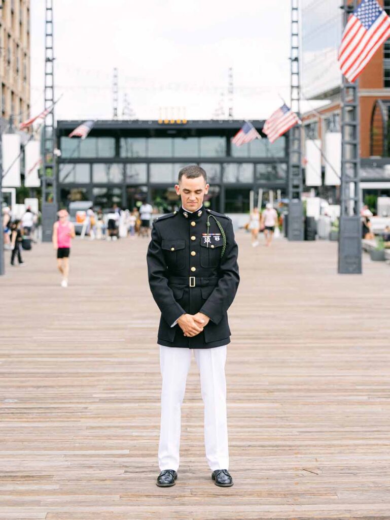 Military groom awaits at The Wharf in Washington DC for his bride to arrive for the first look
