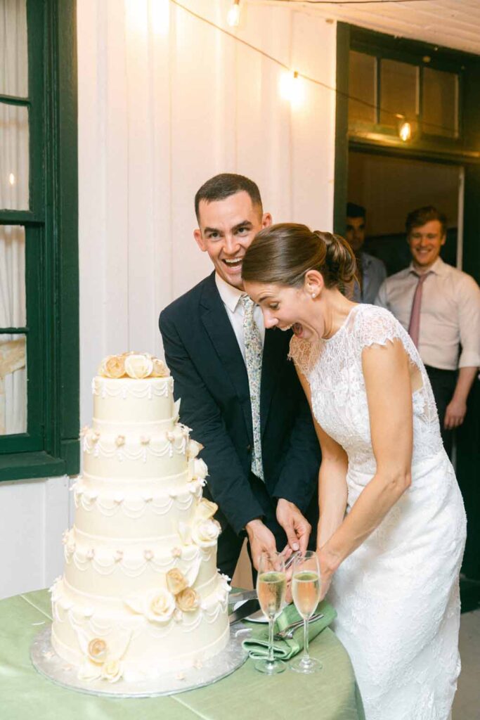 Maryland Tented wedding reception - summery florals - Marlborough Hunt Club  - cake cutting