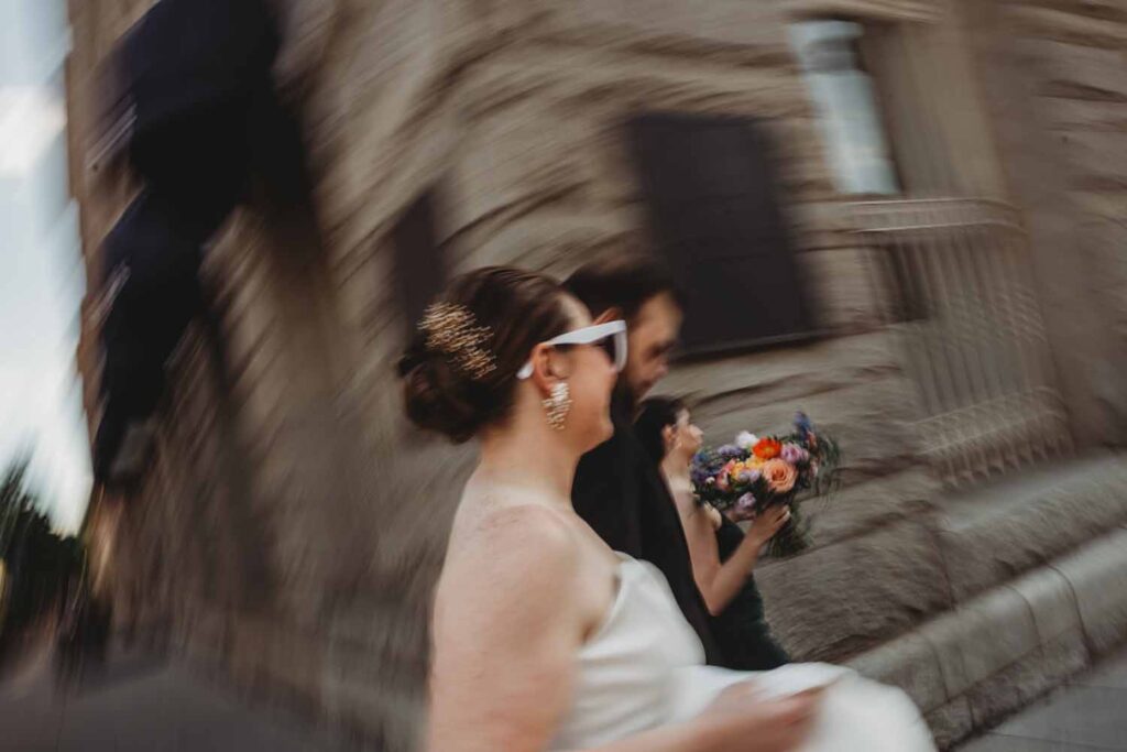 bride and groom blurry - Moody Spring Riggs Hotel Rooftop Wedding