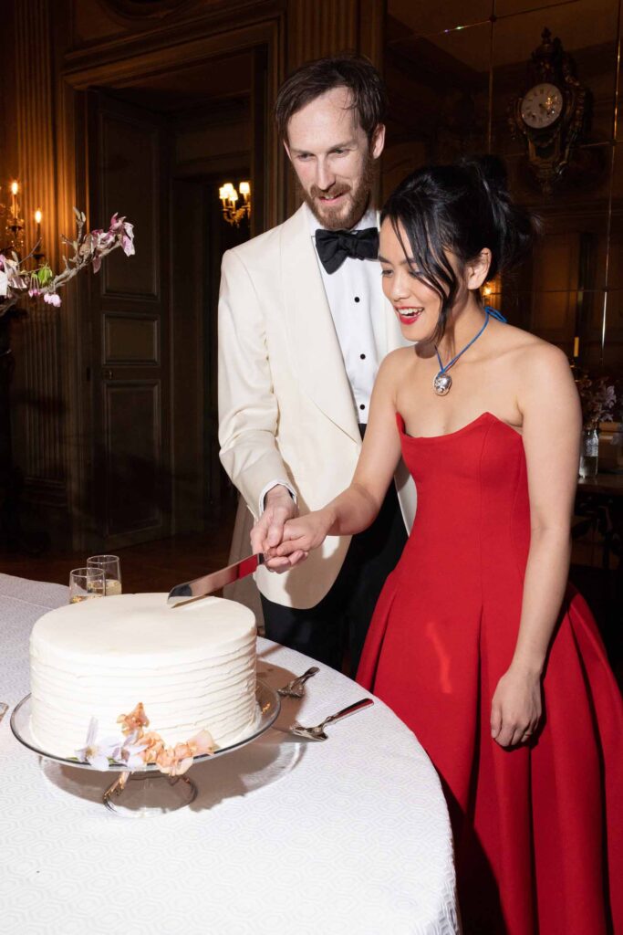 cake cutting - Pretty Spring Meridian House Wedding with Catholic Ceremony