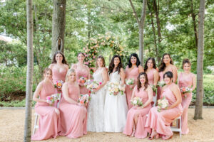 Two brides and 10 pink bridesmaids at Meridian House - Spring wedding