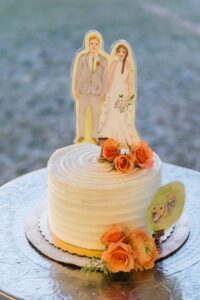 wedding cake cutting cake with custom topper