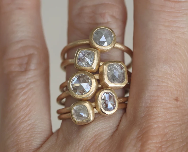 Stacking engagement rings with yellow gold and diamonds