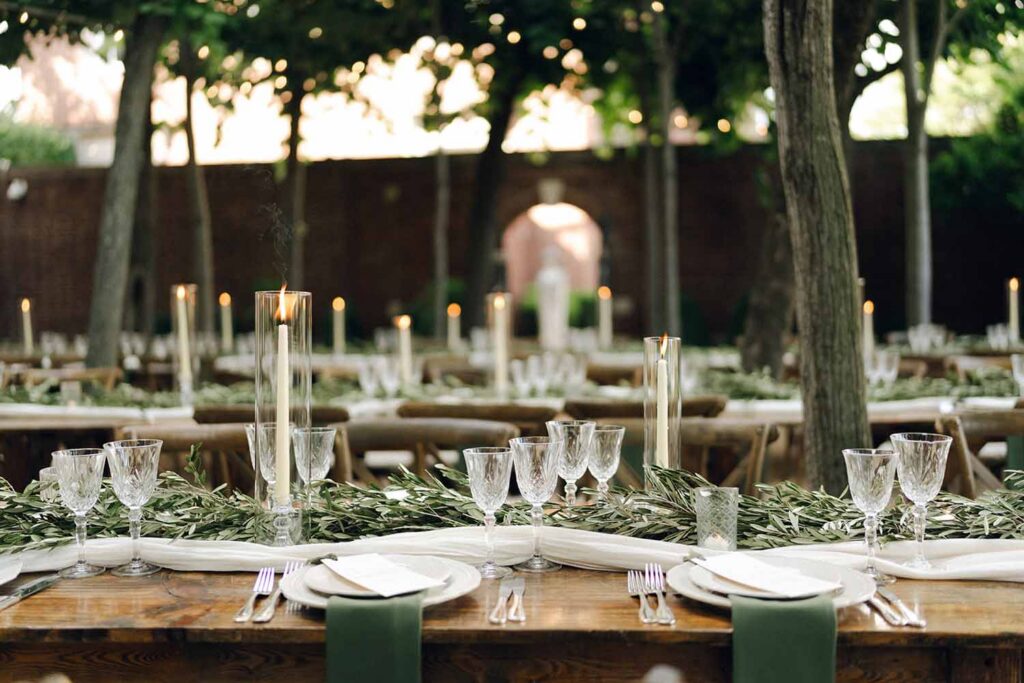 Olive branch decor on wooden farm tables